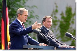 President George W. Bush and German Chancellor Gerhard Schroeder participate in a press conference in the courtyard of Kanzleramt-Chancellery Building in Berlin, Germany, Thursday, May 23